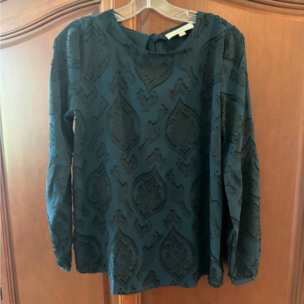 Beautiful dressy blouse in emerald green with the black detail